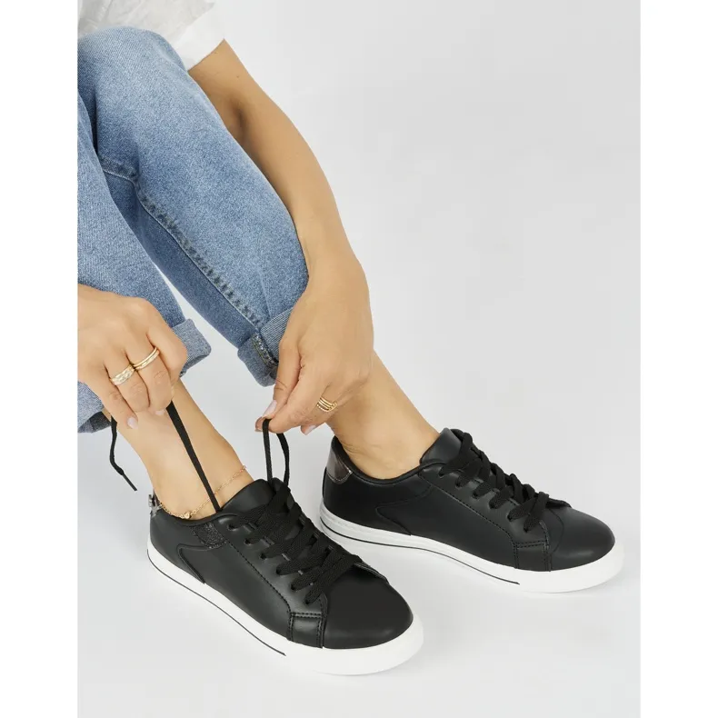 Chaussures de sport noires classiques pour femmes le noir