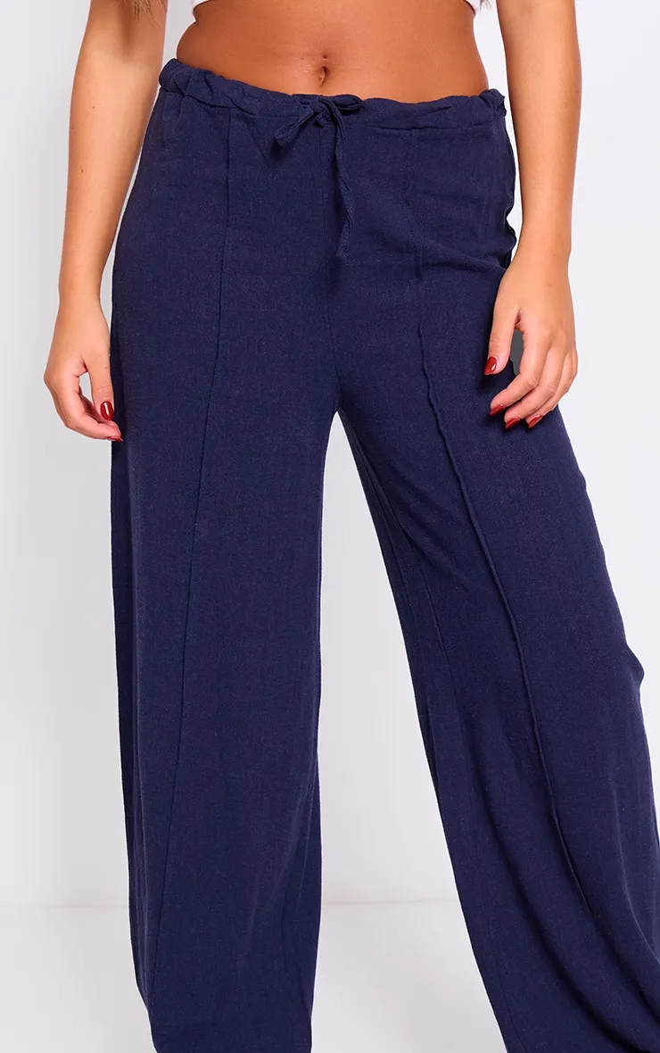 Pantalon ample à pinces en effet lin bleu marine