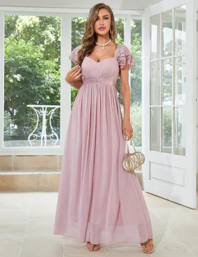 Robe en mousseline de soie rose pâle à col en V profond