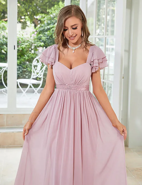 Robe en mousseline de soie rose pâle à col en V profond