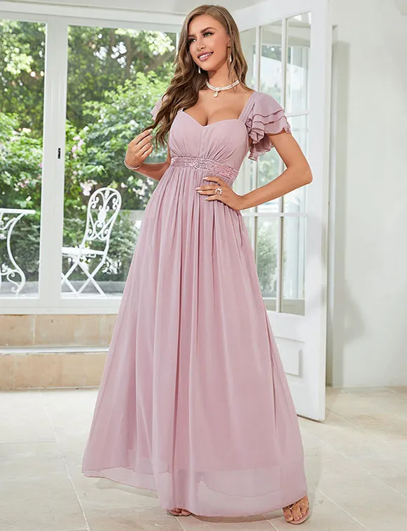 Robe en mousseline de soie rose pâle à col en V profond