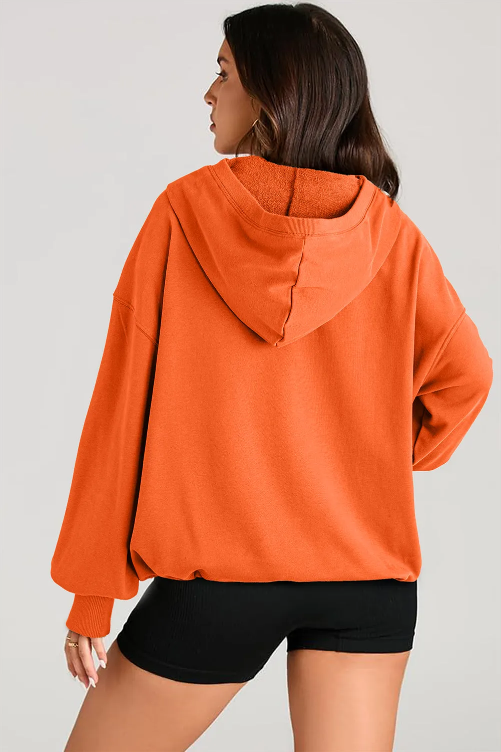 Sweat à capuche surdimensionné orange uni avec poche kangourou et demi-fermeture éclair